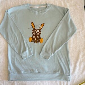 Vintage Light Blue Sweatshirt with Brown and Orange Bunny Design